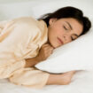 Young woman sleeping on a bed