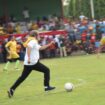 Gubernur Sumsel Herman Deru sedang mengiring bola saat pembukaan piala gubernur 2019 