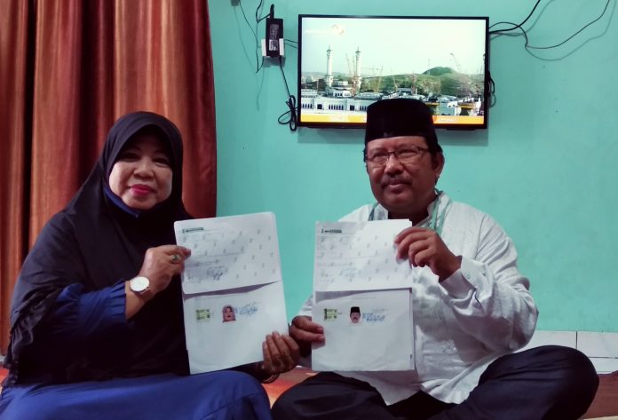 Pasangan suami istri, Refi (kanan) Erlina (kiri) calon jemaah haji asal Palembang yang Gagal Berangkat ke Tanah Suci (Dok. Urban Id)