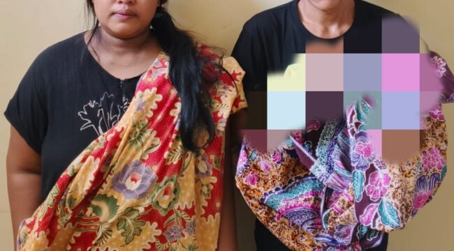 Kedua pelaku yang hendak menjual bayi. Foto : Polda Sumsel