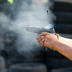 Ilustrasi Penembak menggunakan pistol : Istock